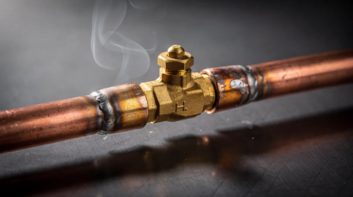 Soldered copper water line with a brass valve